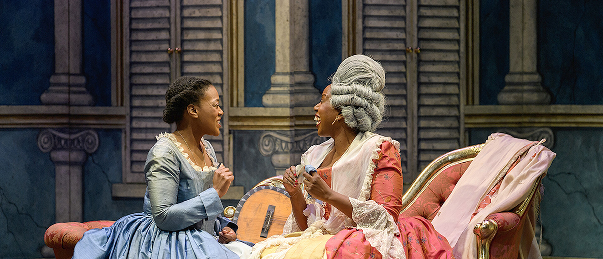 Susanna and The Countess sitting on a chaise longue