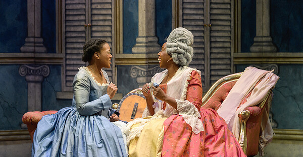 Susanna and The Countess sitting on a chaise longue