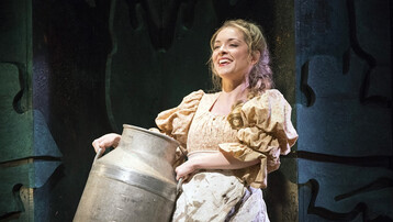 The title charactar smiles in G&S's Patience